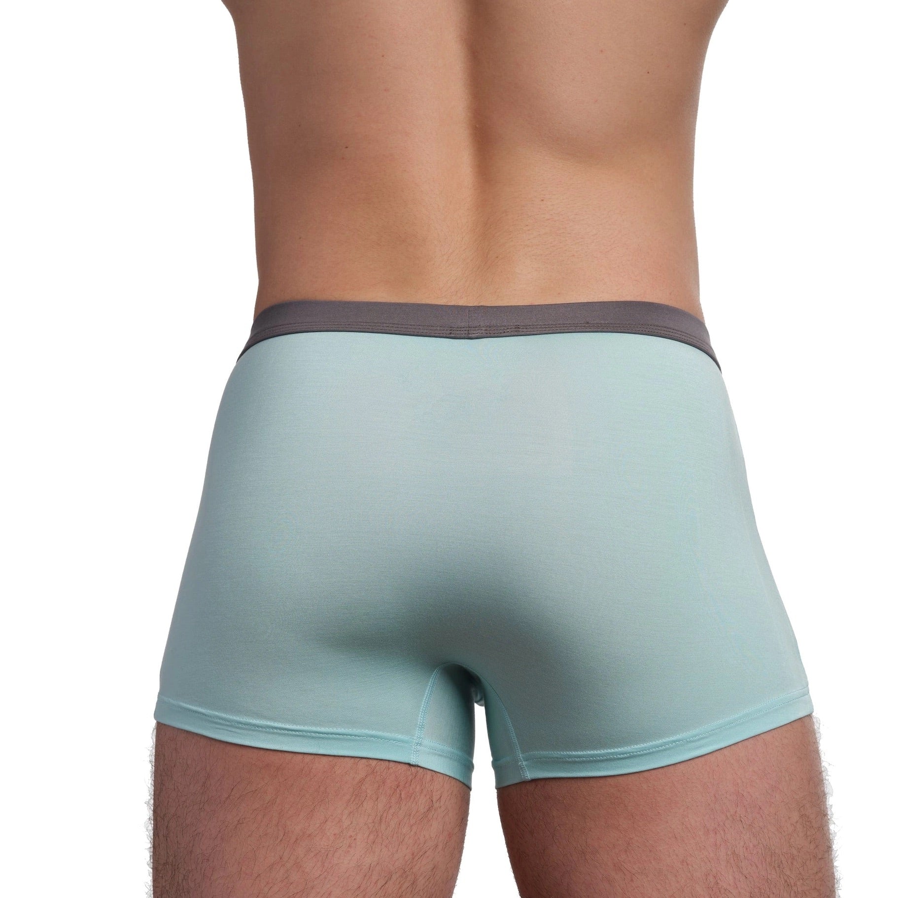 Light blue boxer briefs worn by a person on a white background